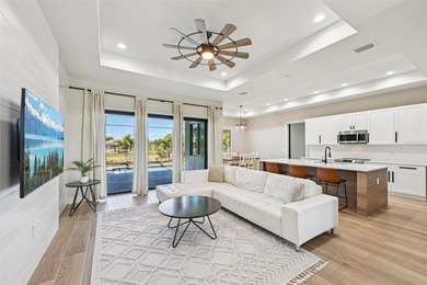 Sunsets, pond and golf course views become part of everyday life on Pinemoor West Golf Club in Florida - for sale on GolfHomes.com, golf home, golf lot