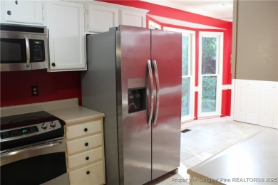 Welcome to this 2-bedroom, 2-bathroom townhome located right on on Kings Grant Golf and Country Club in North Carolina - for sale on GolfHomes.com, golf home, golf lot