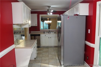 Welcome to this 2-bedroom, 2-bathroom townhome located right on on Kings Grant Golf and Country Club in North Carolina - for sale on GolfHomes.com, golf home, golf lot
