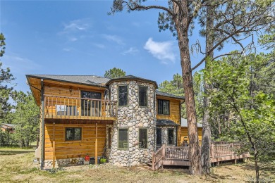 Nestled in the peaceful forest of Larkspur, CO, this mountain on The Golf Club At Bear Dance in Colorado - for sale on GolfHomes.com, golf home, golf lot