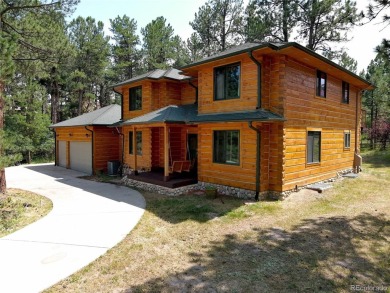 Nestled in the peaceful forest of Larkspur, CO, this mountain on The Golf Club At Bear Dance in Colorado - for sale on GolfHomes.com, golf home, golf lot