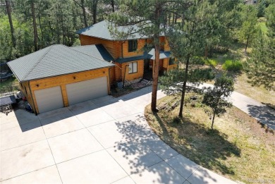 Nestled in the peaceful forest of Larkspur, CO, this mountain on The Golf Club At Bear Dance in Colorado - for sale on GolfHomes.com, golf home, golf lot