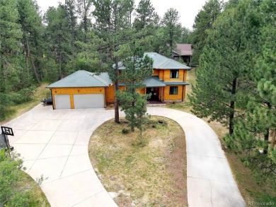 Nestled in the peaceful forest of Larkspur, CO, this mountain on The Golf Club At Bear Dance in Colorado - for sale on GolfHomes.com, golf home, golf lot