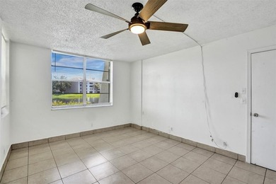 Spacious 2-Bedroom, 2-Bath Condo with Lake Views in Pine Island on Pine Island Ridge Country Club in Florida - for sale on GolfHomes.com, golf home, golf lot