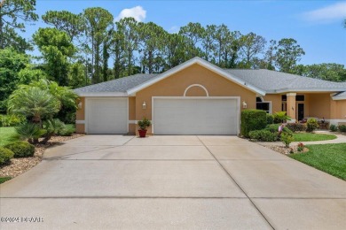 Nestled in the prestigious gated community of Plantation Bay in on Plantation Bay Golf and Country Club in Florida - for sale on GolfHomes.com, golf home, golf lot