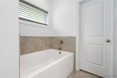 Immaculate, Light-Filled Home with First-Floor Primary & on Olde Liberty Golf and Country Club in North Carolina - for sale on GolfHomes.com, golf home, golf lot