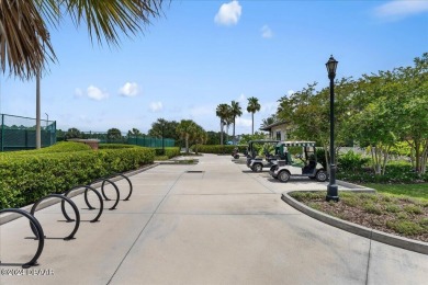 Nestled in the prestigious gated community of Plantation Bay in on Plantation Bay Golf and Country Club in Florida - for sale on GolfHomes.com, golf home, golf lot