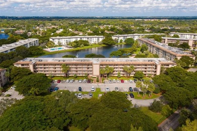 Updated 2-bedroom, 2-bath condo in the beautiful gated community on Wynmoor Golf Course in Florida - for sale on GolfHomes.com, golf home, golf lot