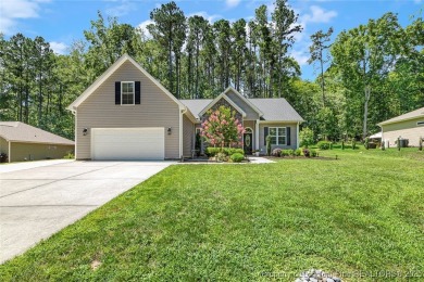 Fabulous home located in the gated and golf community of on Carolina Trace Country Club in North Carolina - for sale on GolfHomes.com, golf home, golf lot