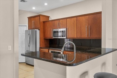 Under contract-accepting backup offers. Live the Country Club on Grasslands Golf and Country Club in Florida - for sale on GolfHomes.com, golf home, golf lot
