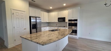 Exceptional residence in the prestigious gated community of on Eagle Creek Golf Club in Florida - for sale on GolfHomes.com, golf home, golf lot