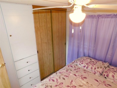Although this is a charming 2-Bedroom, 1.5-Bath Single Wide in on Betmar Acres Golf Club in Florida - for sale on GolfHomes.com, golf home, golf lot