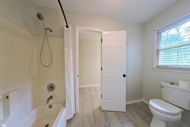 Location! Location! Location! Nestled on a private, wooded lot on Three Pines Country Club in South Carolina - for sale on GolfHomes.com, golf home, golf lot