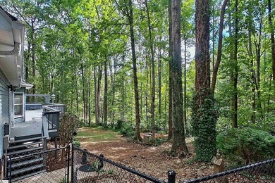Location! Location! Location! Nestled on a private, wooded lot on Three Pines Country Club in South Carolina - for sale on GolfHomes.com, golf home, golf lot