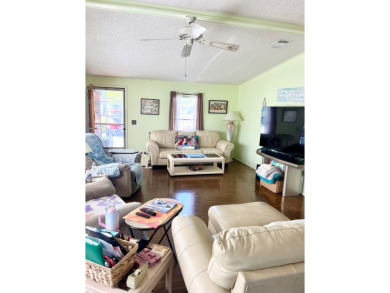 This charming two-bedroom, two-bathroom home is situated on a on Pine Lakes Country Club in Florida - for sale on GolfHomes.com, golf home, golf lot