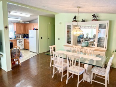 This charming two-bedroom, two-bathroom home is situated on a on Pine Lakes Country Club in Florida - for sale on GolfHomes.com, golf home, golf lot