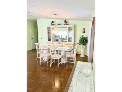 This charming two-bedroom, two-bathroom home is situated on a on Pine Lakes Country Club in Florida - for sale on GolfHomes.com, golf home, golf lot