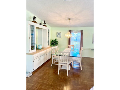 This charming two-bedroom, two-bathroom home is situated on a on Pine Lakes Country Club in Florida - for sale on GolfHomes.com, golf home, golf lot