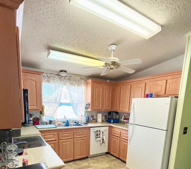 This charming two-bedroom, two-bathroom home is situated on a on Pine Lakes Country Club in Florida - for sale on GolfHomes.com, golf home, golf lot