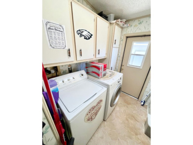 This charming two-bedroom, two-bathroom home is situated on a on Pine Lakes Country Club in Florida - for sale on GolfHomes.com, golf home, golf lot