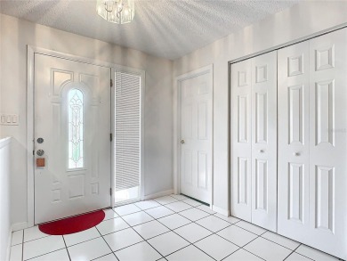 This property listing highlights a spacious home located near on Deltona Golf Club in Florida - for sale on GolfHomes.com, golf home, golf lot