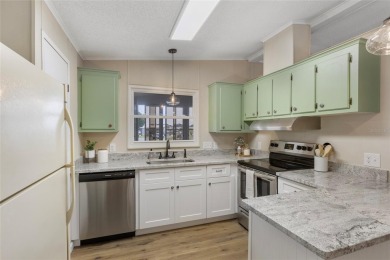Welcome to 8517 Buckingham Place, a beautifully updated home in on Imperial Lakewoods Golf Club in Florida - for sale on GolfHomes.com, golf home, golf lot