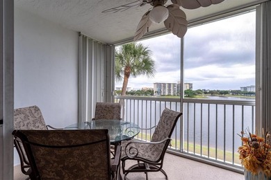 EXPERIENCE EPIC VIEWS from this Gorgeous Updated Lakefront Condo on Palm-Aire Country Club and Resort - Palms in Florida - for sale on GolfHomes.com, golf home, golf lot