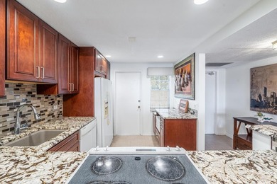 EXPERIENCE EPIC VIEWS from this Gorgeous Updated Lakefront Condo on Palm-Aire Country Club and Resort - Palms in Florida - for sale on GolfHomes.com, golf home, golf lot