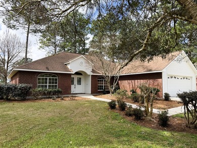 Enjoy the perfect sunset from the massive  picture windows on Pine Creek Golf Club in Mississippi - for sale on GolfHomes.com, golf home, golf lot