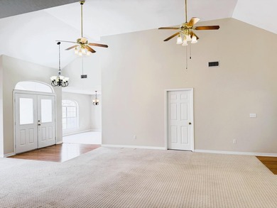 Enjoy the perfect sunset from the massive  picture windows on Pine Creek Golf Club in Mississippi - for sale on GolfHomes.com, golf home, golf lot