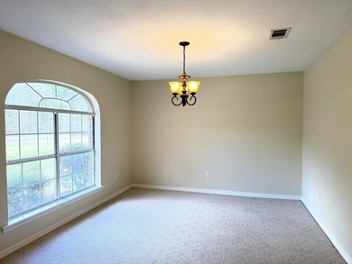 Enjoy the perfect sunset from the massive  picture windows on Pine Creek Golf Club in Mississippi - for sale on GolfHomes.com, golf home, golf lot