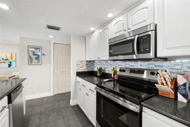 Beautifully Updated Condo with Stunning Golf Course  Pond Views on Pasadena Yacht and Country Club in Florida - for sale on GolfHomes.com, golf home, golf lot