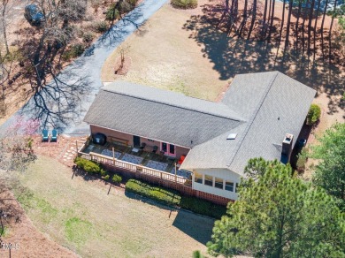 This charming 3-bedroom, 2-bathroom home is situated on a on Quail Ridge Golf Course in North Carolina - for sale on GolfHomes.com, golf home, golf lot