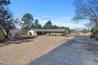 This charming 3-bedroom, 2-bathroom home is situated on a on Quail Ridge Golf Course in North Carolina - for sale on GolfHomes.com, golf home, golf lot