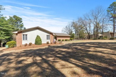 This charming 3-bedroom, 2-bathroom home is situated on a on Quail Ridge Golf Course in North Carolina - for sale on GolfHomes.com, golf home, golf lot
