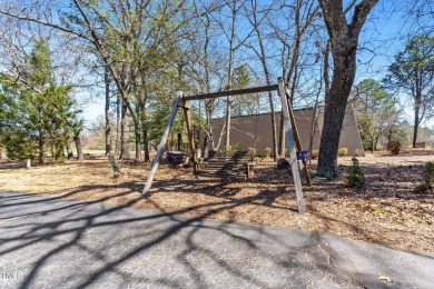 This charming 3-bedroom, 2-bathroom home is situated on a on Quail Ridge Golf Course in North Carolina - for sale on GolfHomes.com, golf home, golf lot
