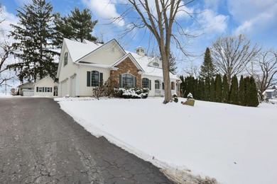 Stunning custom Cape Cod style home in a sought-after lake and on Harbor Hills Country Club in Ohio - for sale on GolfHomes.com, golf home, golf lot