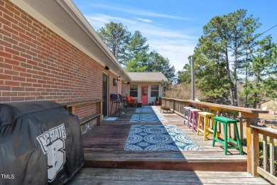 This charming 3-bedroom, 2-bathroom home is situated on a on Quail Ridge Golf Course in North Carolina - for sale on GolfHomes.com, golf home, golf lot