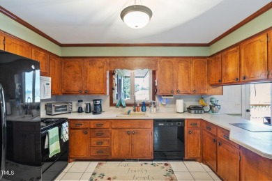 This charming 3-bedroom, 2-bathroom home is situated on a on Quail Ridge Golf Course in North Carolina - for sale on GolfHomes.com, golf home, golf lot