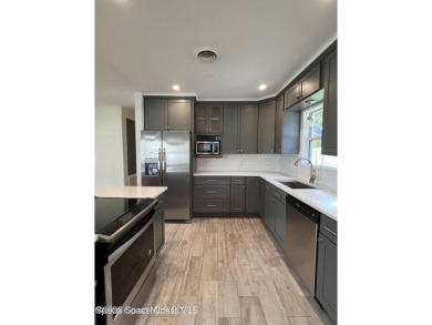 Escape to your private oasis in Country Club Colony - no HOA! on Crane Creek Reserve Golf Club in Florida - for sale on GolfHomes.com, golf home, golf lot
