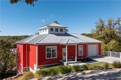 This beautiful 4-bedroom home offers great water views from one on The Oaks Golf Course in Missouri - for sale on GolfHomes.com, golf home, golf lot