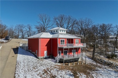 This beautiful 4-bedroom home offers great water views from one on The Oaks Golf Course in Missouri - for sale on GolfHomes.com, golf home, golf lot