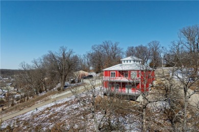 This beautiful 4-bedroom home offers great water views from one on The Oaks Golf Course in Missouri - for sale on GolfHomes.com, golf home, golf lot