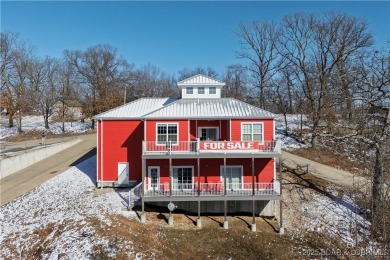 This beautiful 4-bedroom home offers great water views from one on The Oaks Golf Course in Missouri - for sale on GolfHomes.com, golf home, golf lot