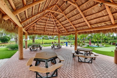 Discover exceptional lakeside living in this rare, rentable on Hillsboro Pines Golf in Florida - for sale on GolfHomes.com, golf home, golf lot