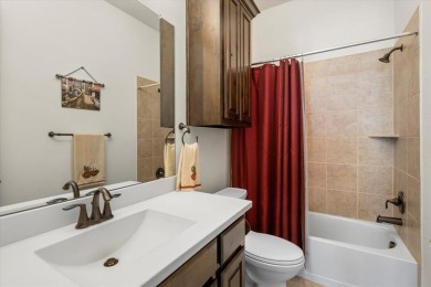 This stunning 1.5-story home with almost 3,400 sqft by American on The Lakes at Castle Hill Golf Club in Texas - for sale on GolfHomes.com, golf home, golf lot