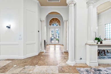 This former model home in Mizner Country Club has IMMEDIATE GOLF on Mizner Country Club in Florida - for sale on GolfHomes.com, golf home, golf lot