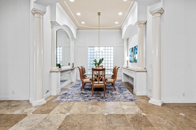 This former model home in Mizner Country Club has IMMEDIATE GOLF on Mizner Country Club in Florida - for sale on GolfHomes.com, golf home, golf lot