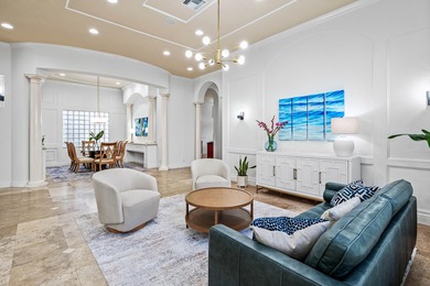 This former model home in Mizner Country Club has IMMEDIATE GOLF on Mizner Country Club in Florida - for sale on GolfHomes.com, golf home, golf lot