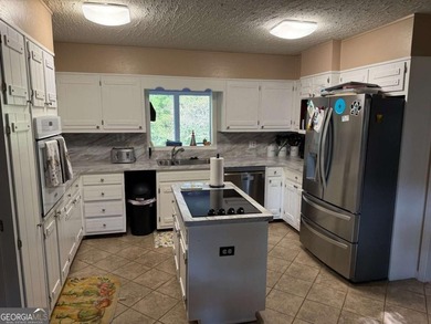 Wonderfully maintained and perfectly located, this 4-bedroom, 2 on Honey Creek Country Club in Georgia - for sale on GolfHomes.com, golf home, golf lot